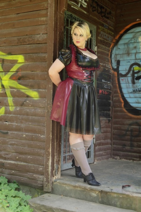 Blonde fatty Darkwing Zero exposes her upskirt panties in a latex dress 18409194